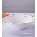 White porcelain fruit bowls with gold rim.